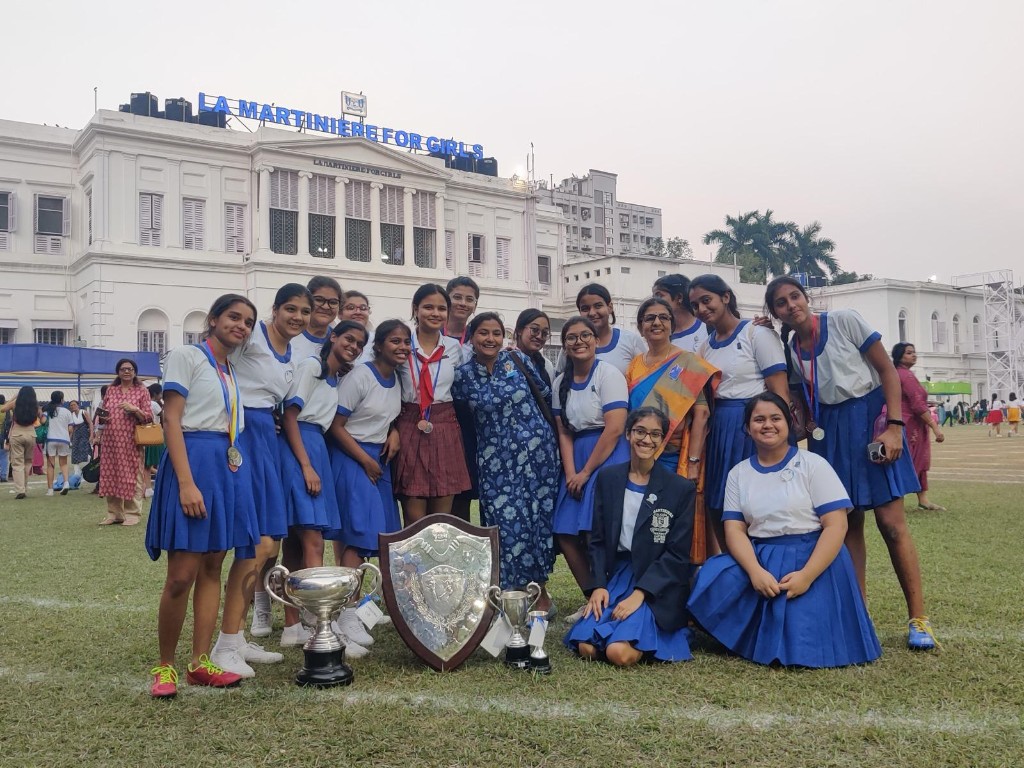 House team celebrating sports day trophies at La Martiniere
