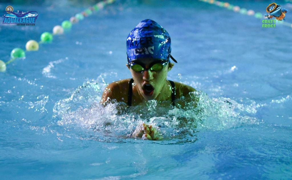 Ishika swimming breaststroke in competition